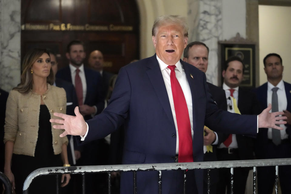 Former President Donald Trump speaks to reporters as he leaves the courtroom during a lunch break in his civil business fraud trial, Wednesday, Oct. 4, 2023, in New York. (AP Photo/Mary Altaffer)