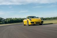 <p>What is essentially a lighter version of the base 911, this <a href="https://www.caranddriver.com/porsche/911-2019" rel="nofollow noopener" target="_blank" data-ylk="slk:Carrera T;elm:context_link;itc:0;sec:content-canvas" class="link ">Carrera T</a> has thinner rear window glass to save weight, and grippy Pirelli P Zero Corsa PZC4 tires around its 20-inch wheels to keep it from floating way. Its <a href="https://www.caranddriver.com/features/a29389455/2018-porsche-911-carrera-t-lightning-lap/" rel="nofollow noopener" target="_blank" data-ylk="slk:controllable handling and quick-shifting dual-clutch automatic transmission;elm:context_link;itc:0;sec:content-canvas" class="link ">controllable handling and quick-shifting dual-clutch automatic transmission</a> add confidence when it comes to pushing the limits. A combination that encourages new drivers to keep learning, and rewards experienced drivers by delivering what they've learned to expect. </p>