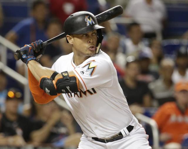 Miami Marlins center fielder Giancarlo Stanton returns to the