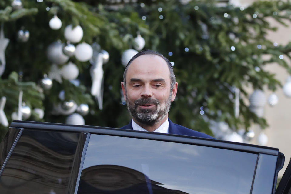 French Prime Minister Edouard Philippe leaves the Elysee Palace after the weekly cabinet meeting Wednesday, Dec.18, 2019 in Paris. With French President Emmanuel Macron under heavy pressure over his pension reform plans, government officials are meeting with employers and unions on Wednesday to consider the way forward. (AP Photo/Francois Mori)