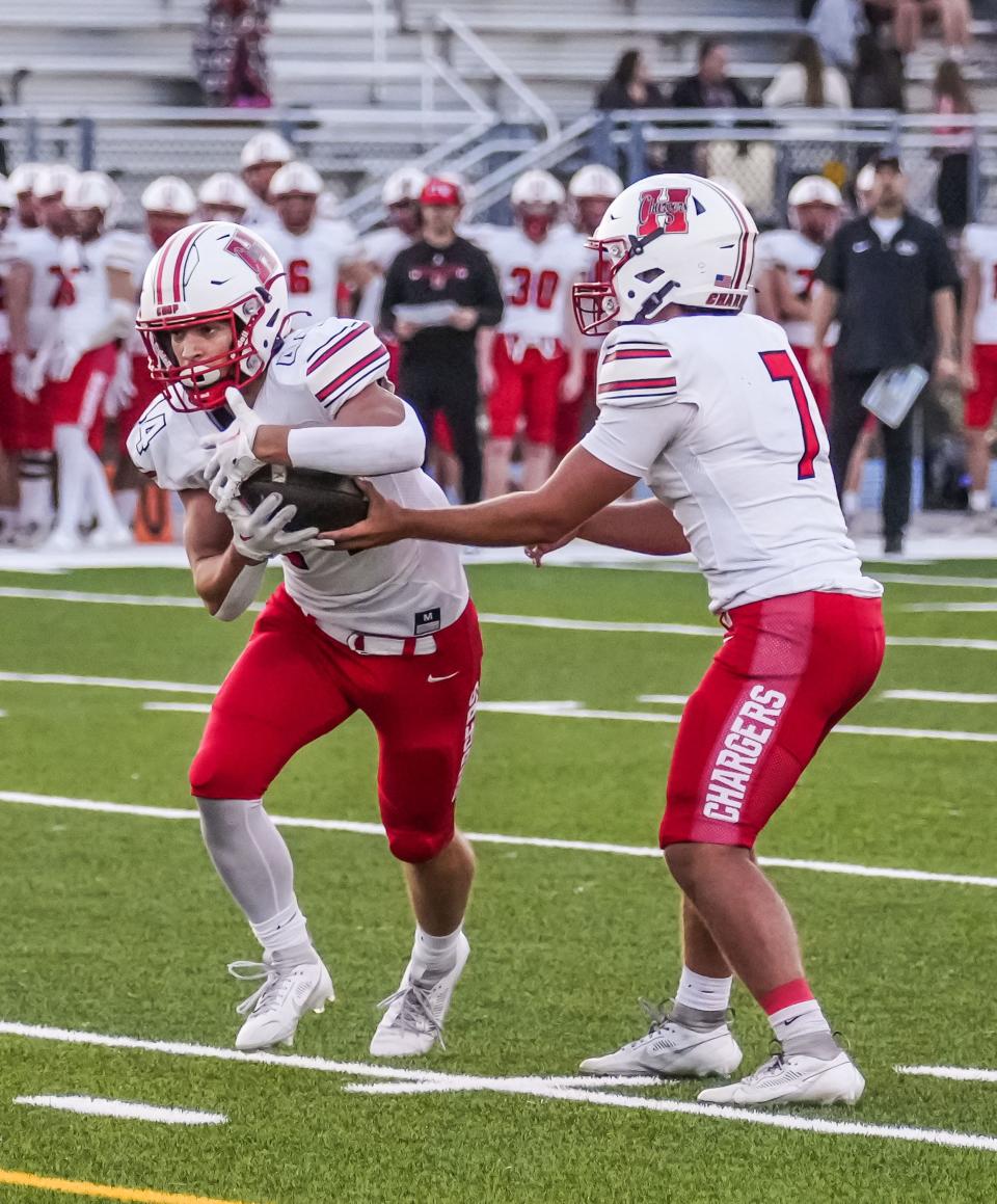 Sussex Hamilton's Hayden Coppersmith (44) takes a handoff from quarterback Tyler Hatcher (7) during the game at West Allis Central, Friday, Sept. 8, 2023.