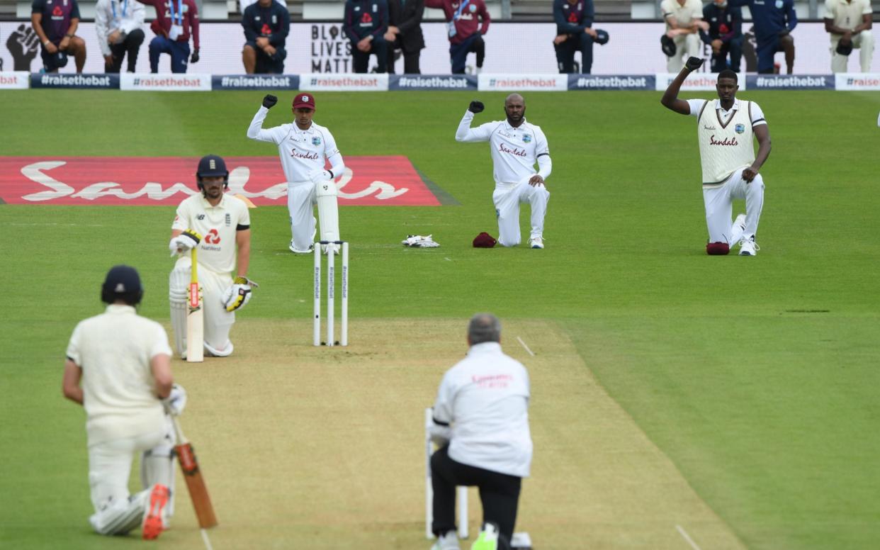 Rory Burns and Dom Sibley of England take a knee alongside Shane Dowrich, Jermaine Blackwood and Jason Holder of the West Indies during day one of the 1st #RaiseTheBat Test match at The Ageas Bowl on July 08, 2020 in Southampton, England - Jos Buttler glad to have sent a "very strong message" as both England and West Indies took the knee before first Test - GETTY IMAGES