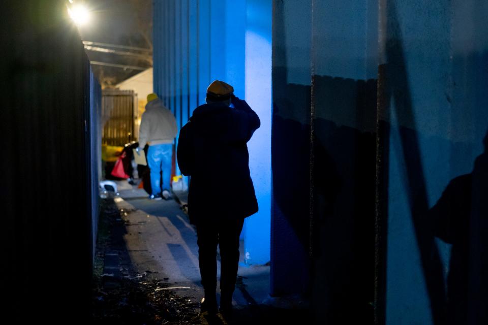 Cale Powers, left, Hailey Drylie-Junker walk along the side of a building in northwest Oklahoma City on Jan. 26 during the Homeless Alliance's 2023 Point in Time count of the homeless population.