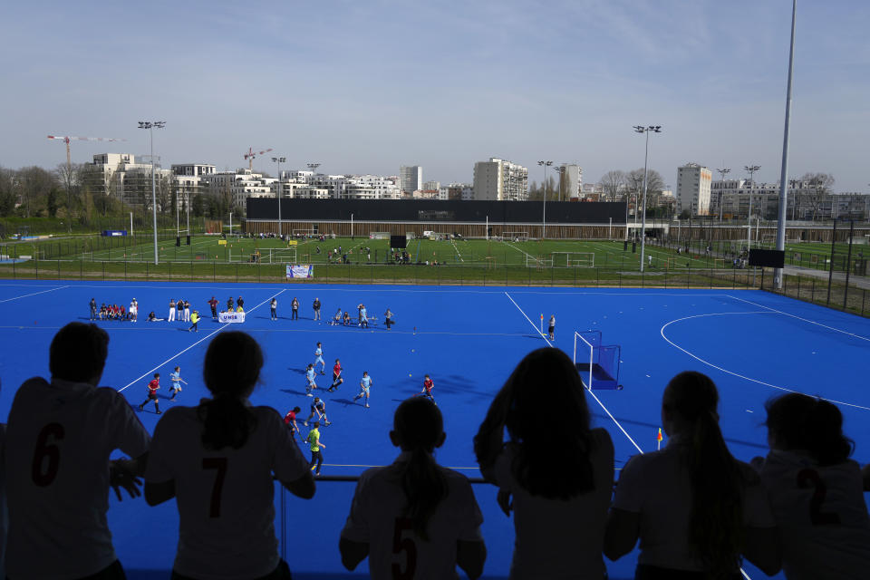 Youths play field hockey, at the renovated Yves-du-Manoir stadium in Colombes, outside Paris, Thursday, March 21, 2024. The stadium will host the men's and women's field hockey competitions during the Pairs 2024 Olympic Games (AP Photo/Thibault Camus, File)