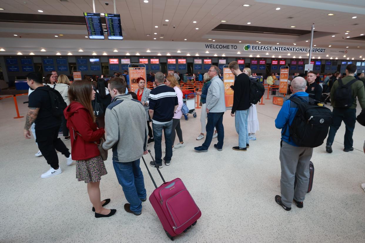 Passengers at Belfast International Airport, as flights to the UK and Ireland have been cancelled as a result of air traffic control issues in the UK (PA)