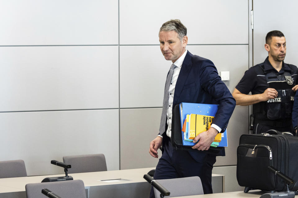 German far-right politician of the Alternative for Germany (AfD) Björn Höcke arrives for a session of his trial over the alleged use of Nazi phrases, at the regional court in Halle, eastern Germany, on Tuesday, April 23, 2024. Höecke, one of the most prominent figures in the far-right Alternative for Germany party, went on trial last Thursday on charges of using a Nazi slogan, months before a regional election in which he plans to run to become his state's governor. (Jens Schlueter/Pool Photo via AP)