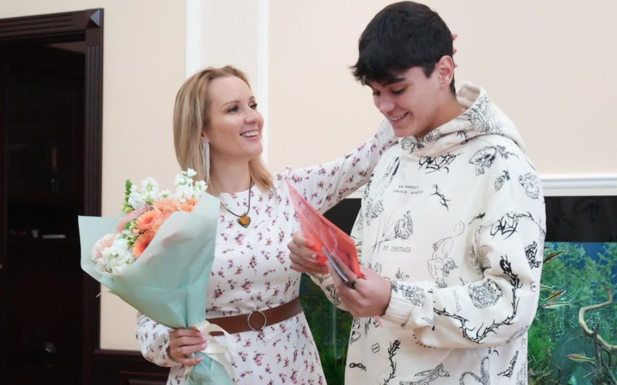 Maria Lvova-Belova with Filipp Golovnya, a 17-year-old boy from Mariupol who is now her adopted son