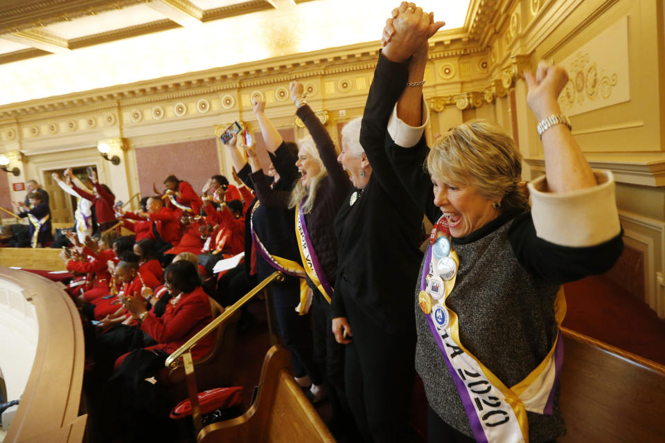 Equal Rights Amendment supporter Donna Granski, right, from Midlothian Va., cheers the passage of the House ERA Resolution in the Senate chambers at the Capitol in Richmond, Va. Monday, Jan. 27, 2020. The resolution passed 27-12. (AP Photo/Steve Helber)