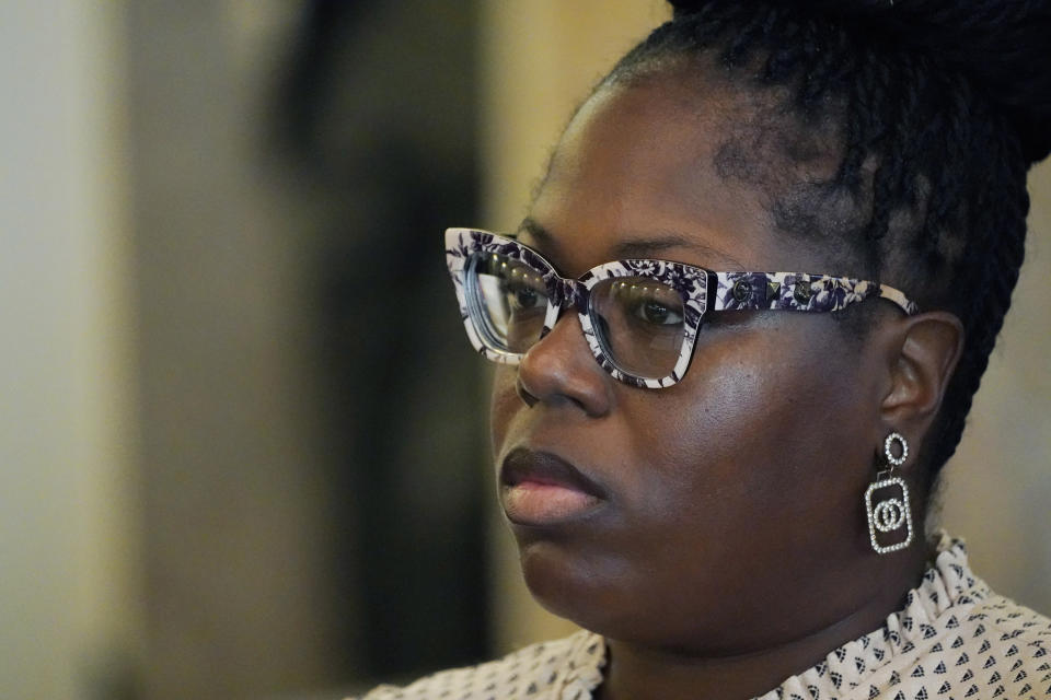 Arkela Lewis, mother of Jaylen Lewis, who was shot to death during an encounter with officers of the Mississippi Capitol Police department, looks at members of the Jackson delegation of the Mississippi Legislature after testifying before them at the Mississippi Capitol in Jackson, Monday, March 6, 2023. Lewis was one of several witnesses who spoke against a bill that would increase state involvement in the Hinds County court system and expand the jurisdiction of Capitol Police inside the city of Jackson. (AP Photo/Rogelio V. Solis)