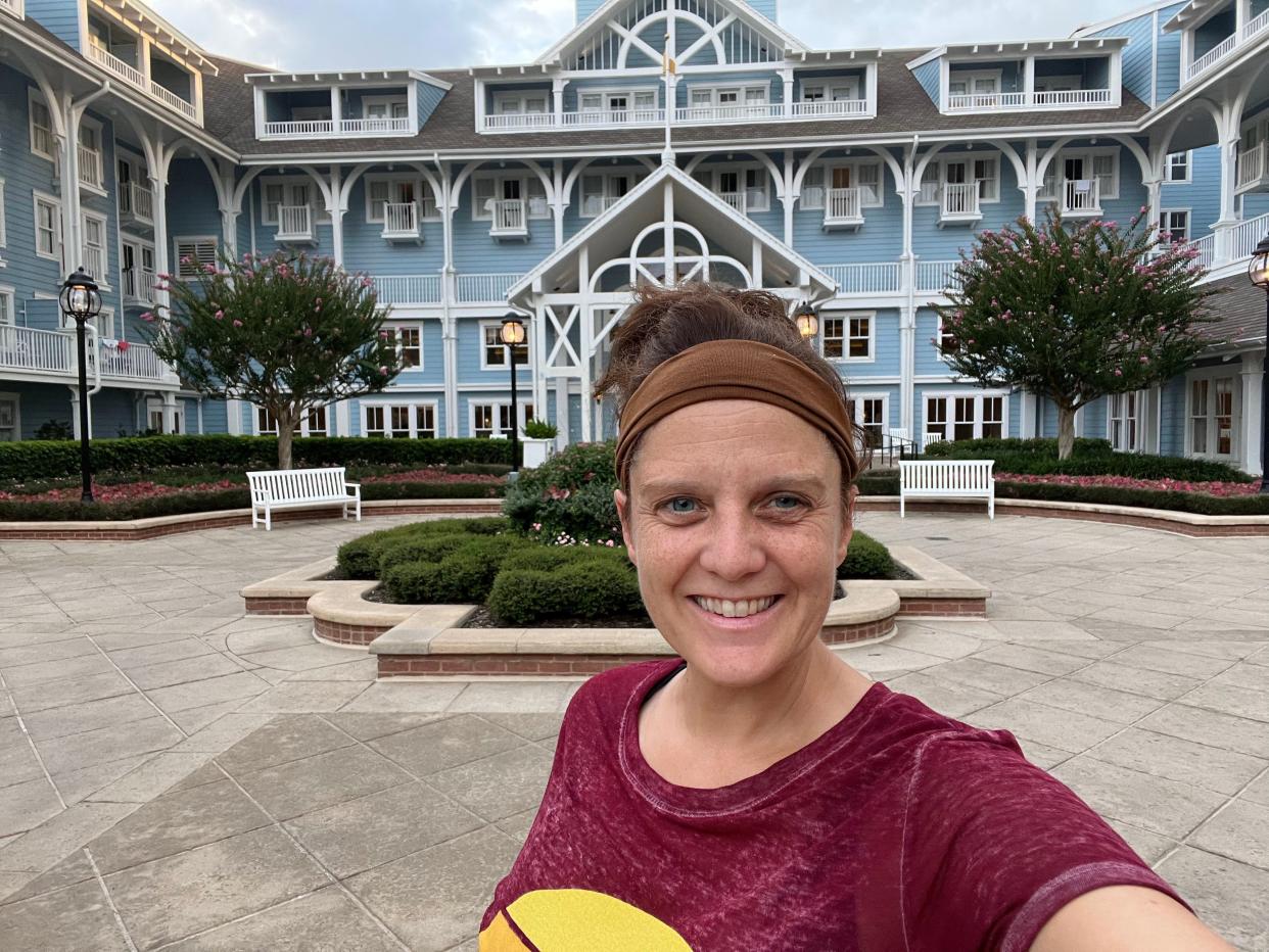 kari posing in front of beach club resort at disney world 