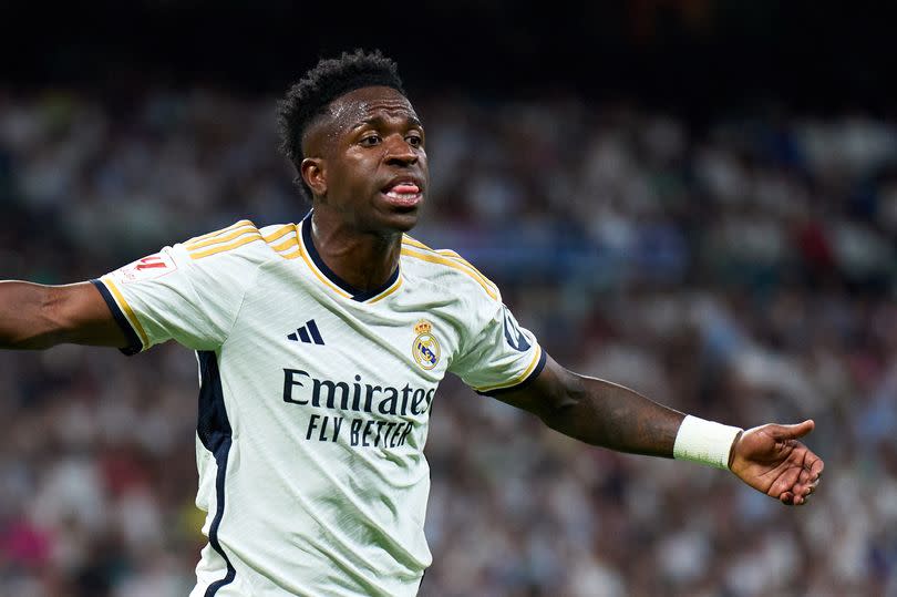 Vinícius Júnior turns to argue with an assistant referee while playing for Real Madrid against Real Betis.