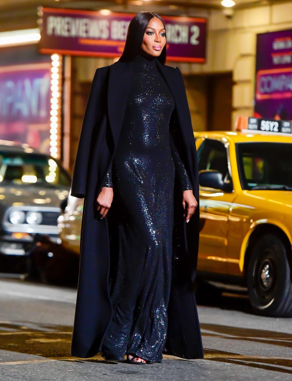 <p>Naomi Campbell steals the spotlight as she walks through Times Square in the Michael Kors fashion show on Thursday in N.Y.C.</p>