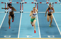 Sally Pearson of Australia crosses the line to win gold ahead of silver medalist Tiffany Porter of Great Britain (L), Eline Berings of Belgium (R) in the Women's 60 Metres Hurdles Final during day two of the 14th IAAF World Indoor Championships at the Atakoy Athletics Arena on March 10, 2012 in Istanbul, Turkey. (Photo by Ian Walton/Getty Images)