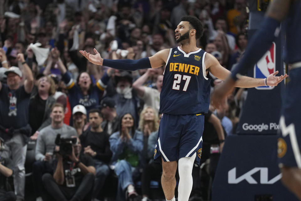 Denver Nuggets guard Jamal Murray (27) celebrates a three pointer against the Los Angeles Lakers during the second half of Game 2 of the NBA basketball Western Conference Finals series, Thursday, May 18, 2023, in Denver. (AP Photo/Jack Dempsey)