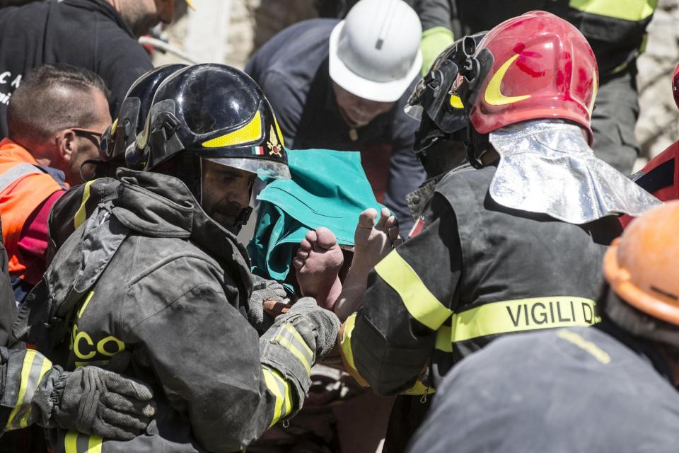 <p>An injured man is carried on a stretcher by rescuers following an earthquake in Accumoli, central Italy, Wednesday, Aug. 24, 2016. (Angelo Carconi/ANSA via AP) </p>