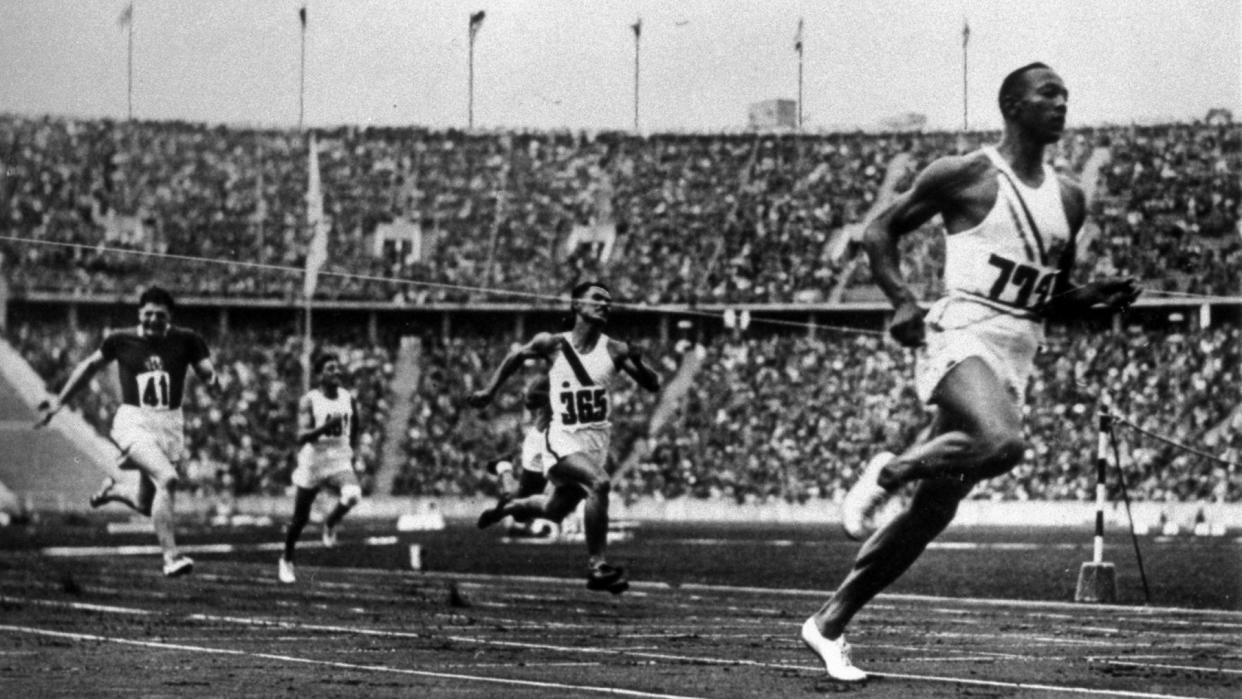 Jesse Owens running at 1936 Olympics in Berlin