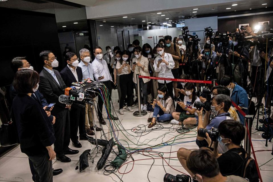 Director of Leisure and Cultural Services Vincent Liu (2nd-L), Secretary for Culture, Sports and Tourism Kevin Yeung (3rd-L) and Secretary for Labour and Welfare Chris Sun (4th-L) attend a press conference in Hong Kong on July 29, 2022, after two support dancers were injured, one seriously, at a concert for Canto pop boy band Mirror when an LED display screen fell from the ceiling on July 28.