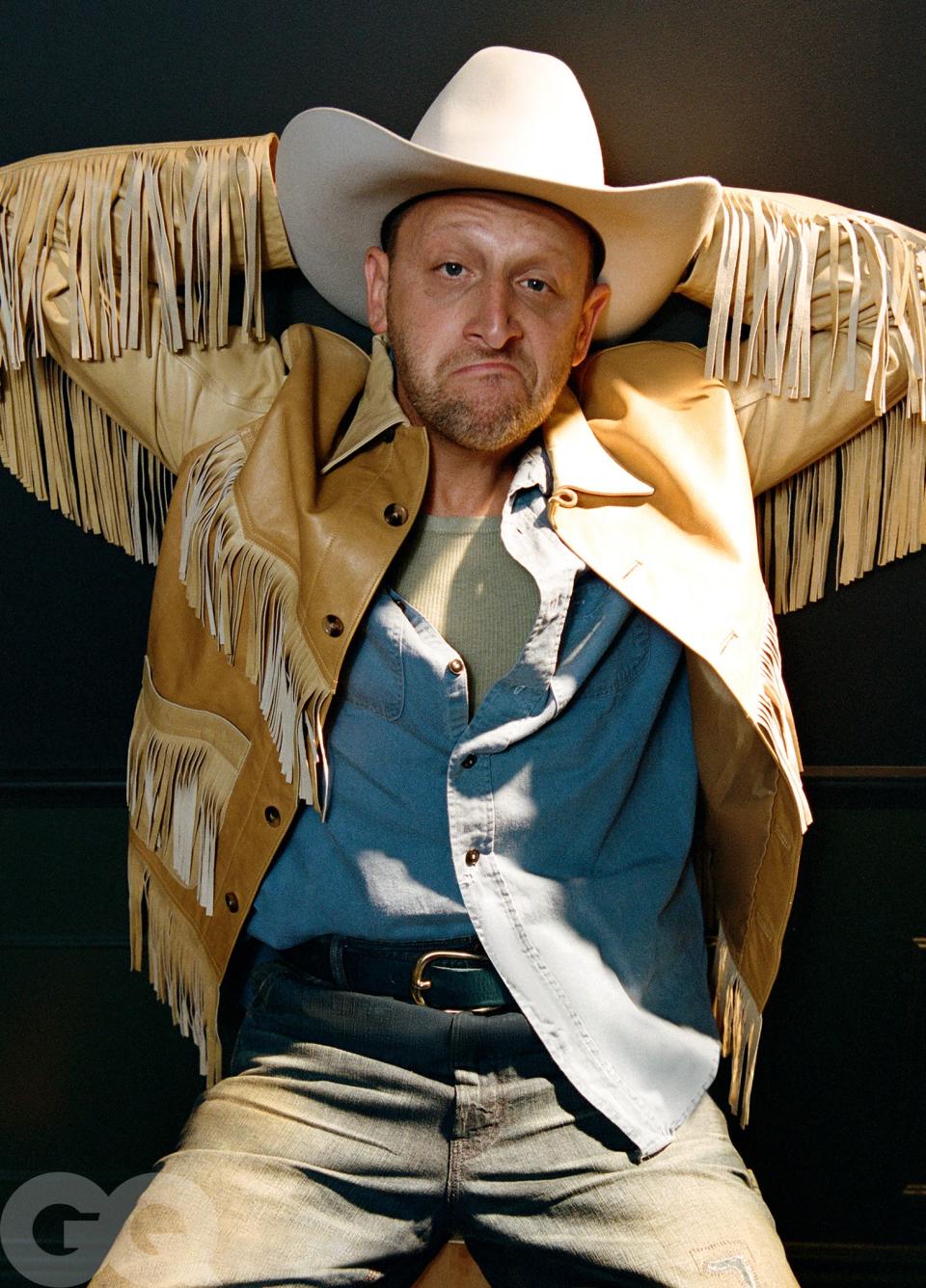 Jacket by Bode. Shirt and tank top by from Raggedy Threads. Jeans by Polo Ralph Lauren. Belt by Artemas Quibble. Hat by Stetson.