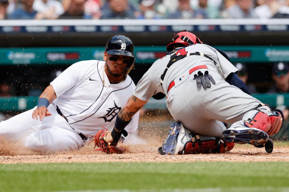 Detroit Tigers shortstop Isaac Paredes (19) is tagged out at home by St. Louis Cardinals catcher Yadier Molina (4) in the sixth inning at Comerica Park, June 23, 2021.