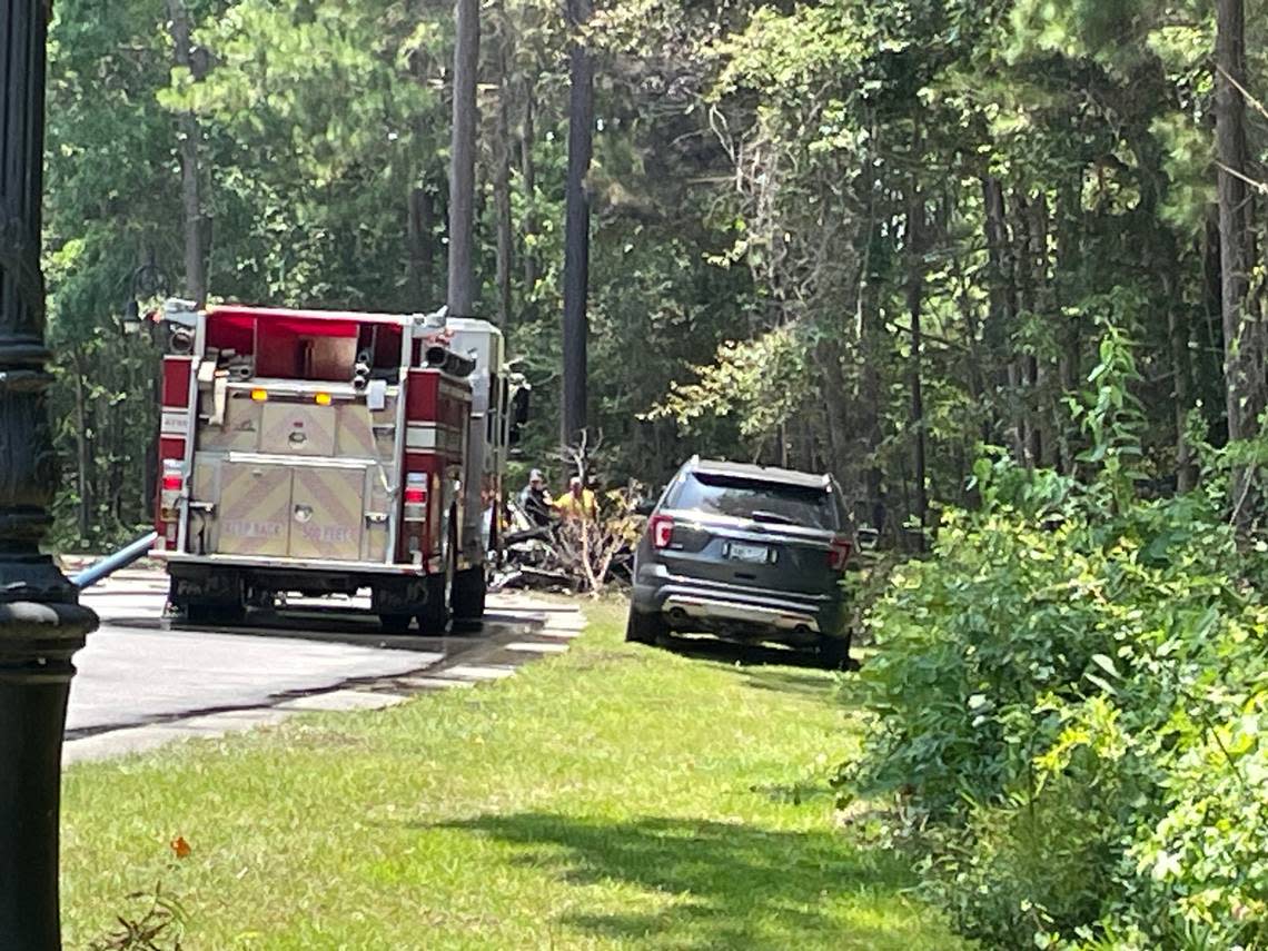 North Myrtle Beach crews responded to a single engine plane crash in the area of Barefoot Landing on July 2, 2023. The plane’s wreckage can be seen near rescue vehicles.