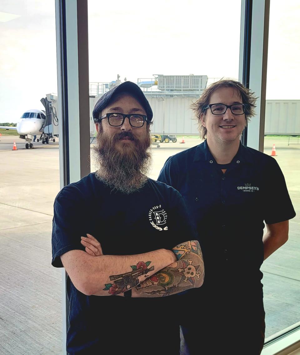 David Solum, left, and Sean Dempsey invite the public to explore their diverse pizza options while overlooking the runway at the new Danger von Dempsey's ATY.