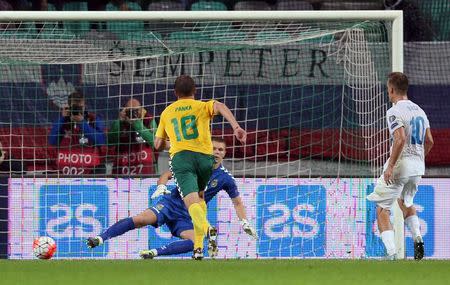 Slovenia's Valter Birsa (R) scores a goal during their Euro 2016 qualifying soccer match against Lithuania in Petrol arena in Ljubljana, Slovenia, October 9, 2015. REUTERS/Srdjan Zivulovic