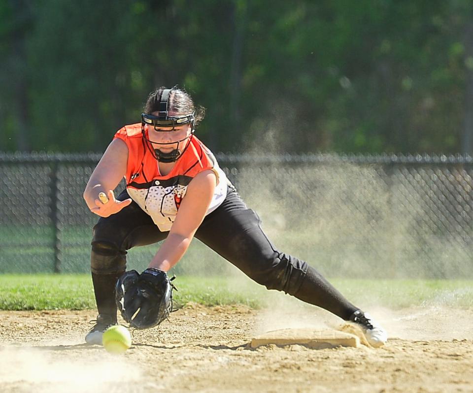 Diman’s Hannah Martin fields a ground ball during a game against Southeastern.