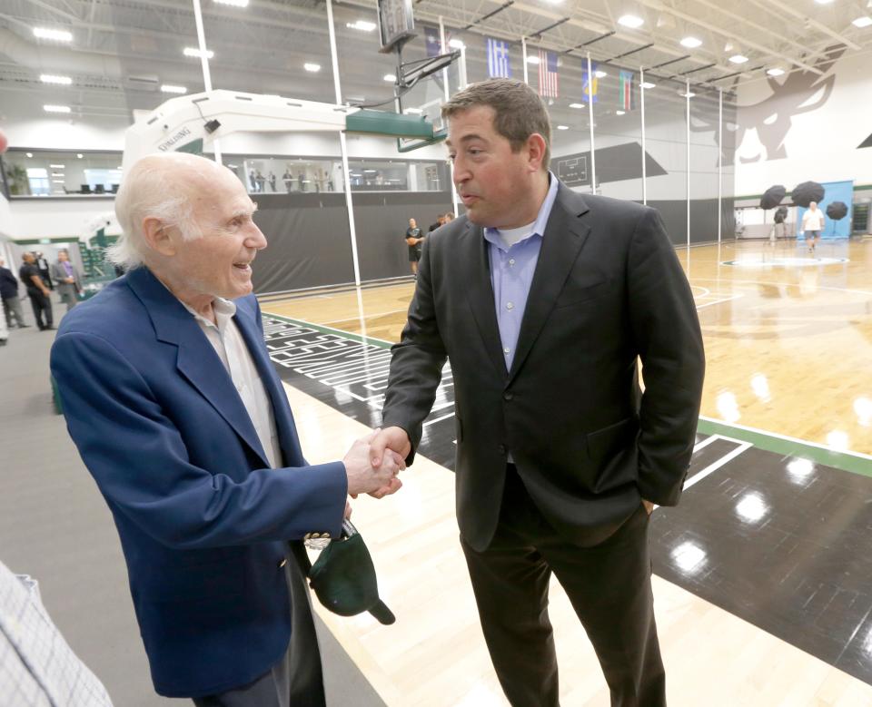 Former Milwaukee Bucks owner Herb Kohl, left, shakes hands with Milwaukee Bucks president Peter Feigin at media day on Sept. 25, 2017. inside the new Froedtert & the Medical College of Wisconsin Sports Science Center.