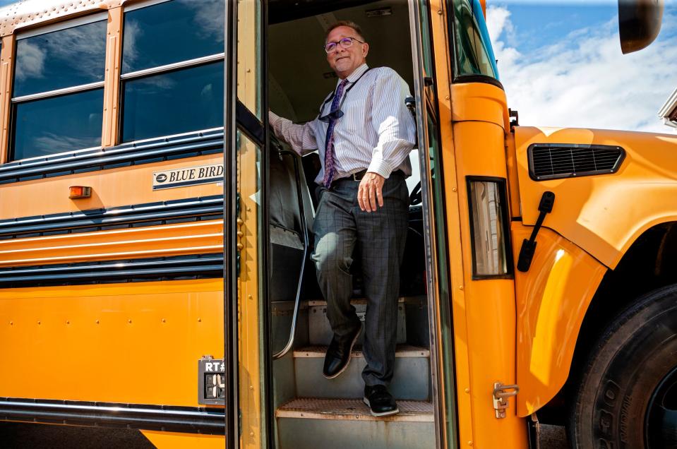 State selected interim superintendent, Monty Guthrie, walks off the bus he drove to get children to and from class on the first day of school in the Western Heights school district in Oklahoma City, Okla. on Wednesday, Aug. 18, 2021. 