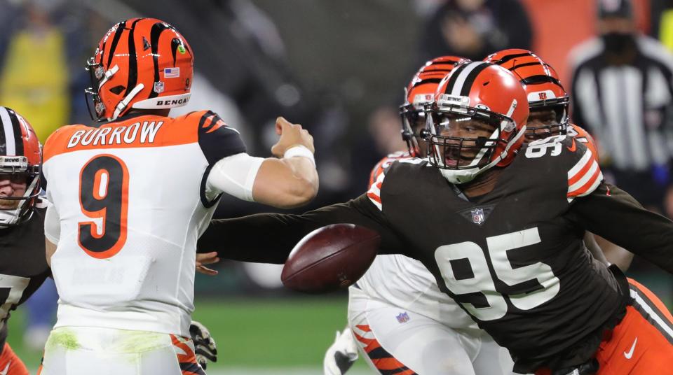 Cleveland Browns defensive end Myles Garrett strips the ball from Cincinnati Bengals quarterback Joe Burrow.