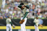 South Korea's Junho Jeong wipes his face after Endwell, N.Y.'s Ryan Harlost scored on a passed ball during the fourth inning of the Little League World Series Championship baseball game, Sunday, Aug. 28, 2016, in South Williamsport, Pa. (AP Photo/Matt Slocum)