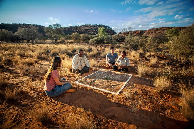 <p>Courtesy of Tourism Australia</p> Talking dot painting with Karrke Aboriginal Cultural Experience & Tours, in Australia's Northern Territory.