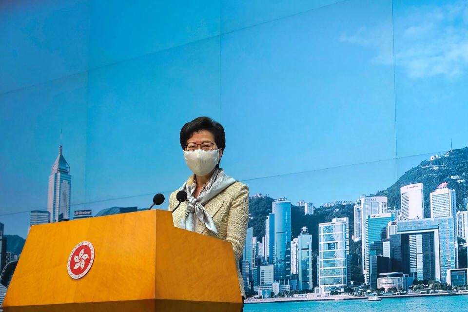 Hong Kong Chief Executive Carrie Lam listens to reporters' questions during a press conference in Hong Kong, Tuesday, June 30, 2020. Hong Kong media are reporting that China has approved a contentious law that would allow authorities to crack down on subversive and secessionist activity in Hong Kong, sparking fears that it would be used to curb opposition voices in the semi-autonomous territory. Lam declined to comment on the national security law at a weekly meeting with reporters, saying it was “inappropriate” for her to do so while the Standing Committee meeting was still in progress.(AP Photo/Vincent Yu)