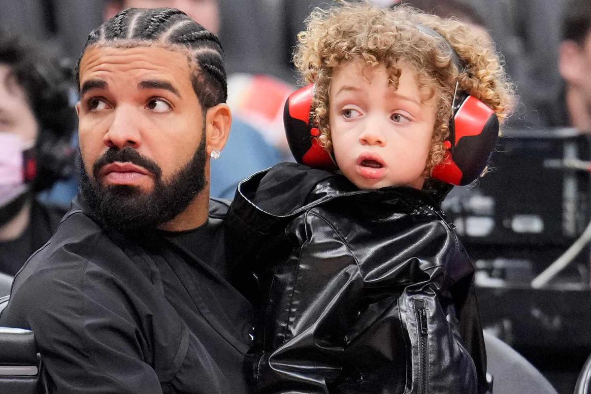 Drake and son Adonis, 5, match in leather jackets at basketball game