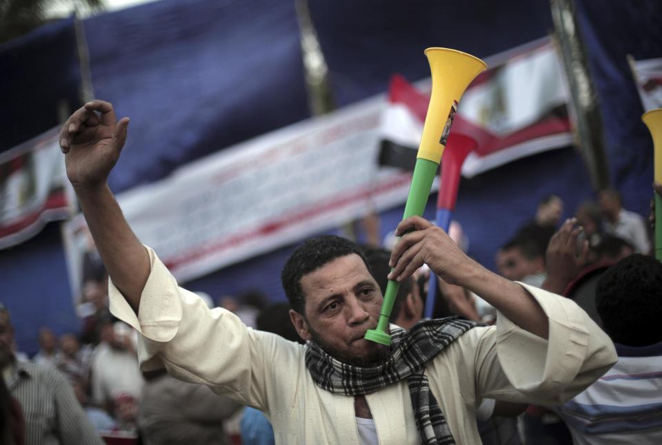 Egyptian supporters of presidential candidate, Abdel-Fattah el-Sissi, chant slogans and dance during a campaign event in Cairo, Egypt, Saturday, May 10, 2014. El-Sissi, is seen as the overwhelming favorite to win the May 26-27 election. So far, el-Sissi, is riding an overwhelming media frenzy lauding him as Egypt’s savior for overthrowing Islamist President Mohammed Morsi last summer. (AP Photo/Khalil Hamra)