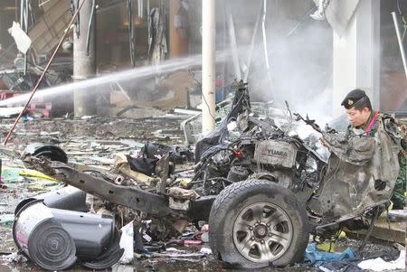 A military personnel inspects the site of a bomb attack at a supermarket in the city of Pattani, Thailand, May 9, 2017. REUTERS/Surapan Boonthanom