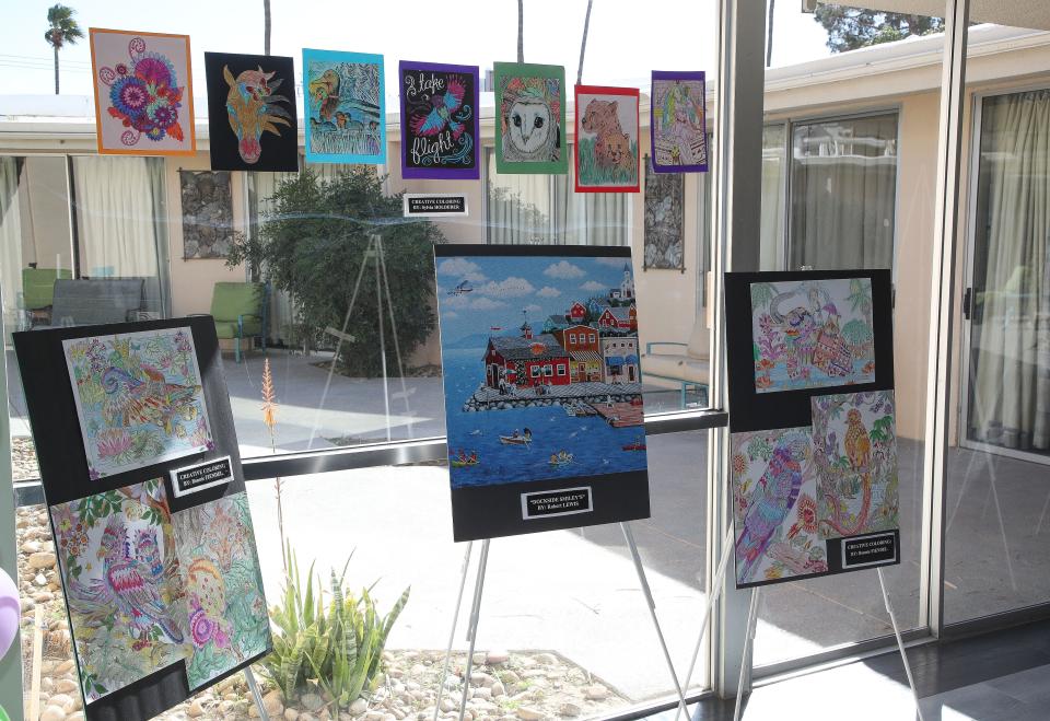 Artworks by residents at at the California Nursing and Rehabilitation Center are on display during an art showcase in Palm Springs, Calif., Feb. 22, 2023. 