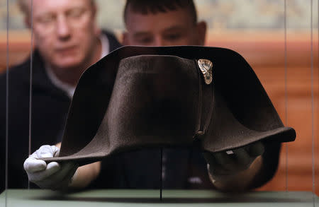 Transport staff members prepare to pack the two-cornered hat worn by French Emperor Napoleon during the Battle of Waterloo in 1815, at the Museum of Sens in the Burgundy region March 10, 2015. REUTERS/Christian Hartmann