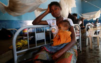 <p>An internally displaced Congolese woman holds her severely acute malnourished child as they wait to receive medical attention at the Presbyterian hospital in Dibindi zone of Mbuji Mayi in Kasai Oriental Province in the Democratic Republic of Congo, March 16, 2018. (Photo: Thomas Mukoya/Reuters) </p>