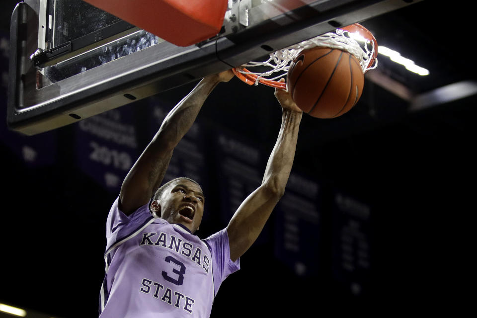 Kansas State's DaJuan Gordon dunks the ball during the second half of an NCAA college basketball game against West Virginia Saturday, Jan. 18, 2020 in Lawrence, Kan. Kansas State won 84-68. (AP Photo/Charlie Riedel)