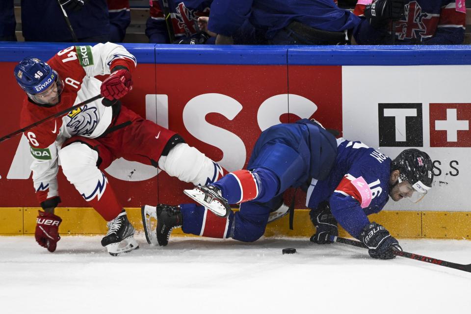 Czech Republic's David Krejci, left, and Great Britain's Sam Duggan in action during the 2022 IIHF Ice Hockey World Championships preliminary round group B match between Czech Republic and Great Britain in Tampere, Finland, Saturday, May 14, 2022. (Emmi Korhonen/Lehtikuva via AP)