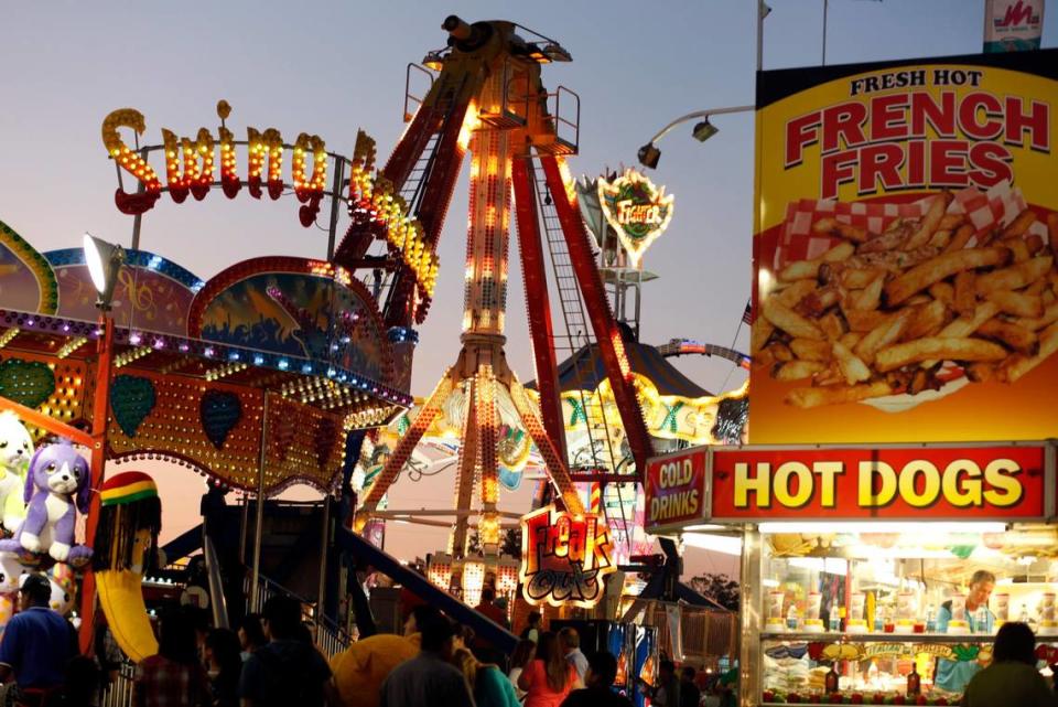 The lights from rides, food trailers, and games light the midway of the N.C. State Fair in Raleigh. File photo