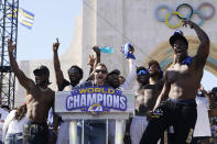 Los Angeles Rams head coach Sean McVay, center, reacts with players at Los Angeles Memorial Coliseum following the team's victory parade in Los Angeles, Wednesday, Feb. 16, 2022. The Rams beat the Cincinnati Bengals Sunday in the NFL Super Bowl 56 football game. (AP Photo/Marcio Jose Sanchez)