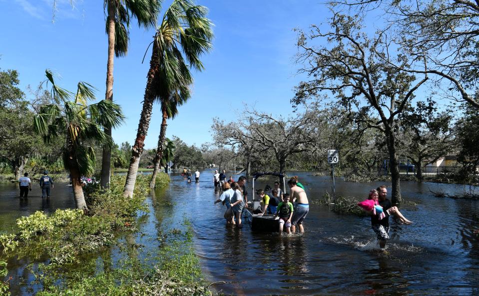 North Port residents used kayaks, paddle boards and other small watercraft to traverse flooded roads that surrounded their homes in North Port during Hurricane Ian.