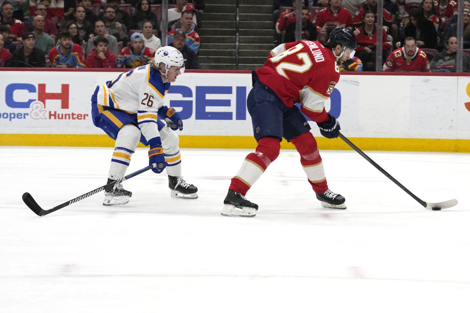 Florida Panthers center Kevin Stenlund (82) prepares to shoot on the goal to score as Buffalo Sabres defenseman Rasmus Dahlin (26) defends during the first period of an NHL hockey game, Saturday, April 13, 2024, in Sunrise, Fla. (AP Photo/Lynne Sladky)