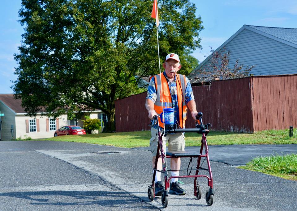 Robert Norris, 63, at the start of a morning walk Friday in his neighborhood south of Hagerstown. Walking two hours a day and riding his exercise bike, as well as healthier eating, helped him lose about 40 pounds.