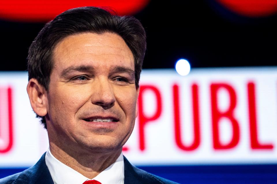 Presidential candidate Ron DeSantis stands behind his podium during a commercial break of the Republican presidential debate between Nikki Haley and Ron DeSantis at Sheslow Auditorium on the Drake University campus on Wednesday, Jan. 10, 2024, in Des Moines.