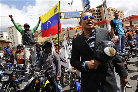 Motorcyclists take part in a protest against possible regulation and schedule bans as a measure to combat insecurity in Caracas January 31, 2014. REUTERS/Jorge Silva