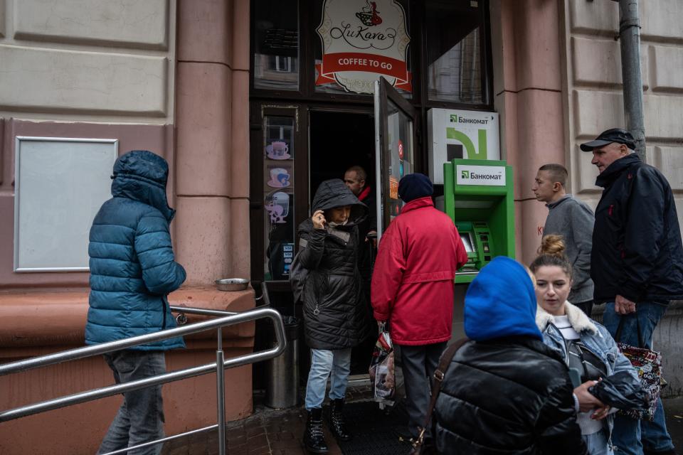 Ukrainians wait to enter supermarket in Kharkiv following a power cut (Getty Images)