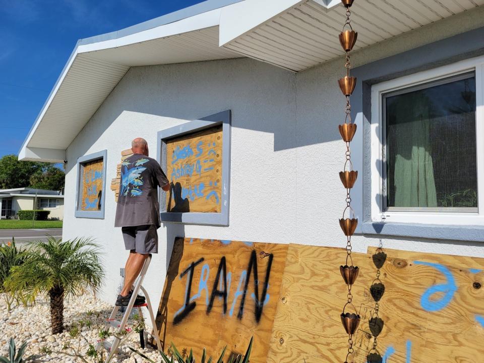 Dominique Gagnier and his wife, Yvette, were prepping for Hurricane Ian in Holmes Beach, Fla. The couple was here when Hurricane Irma came through and started preparing a few days ago. Yvette said she's most worried about the storm surge. She added that once their home is boarded up, they'll help their neighbors.